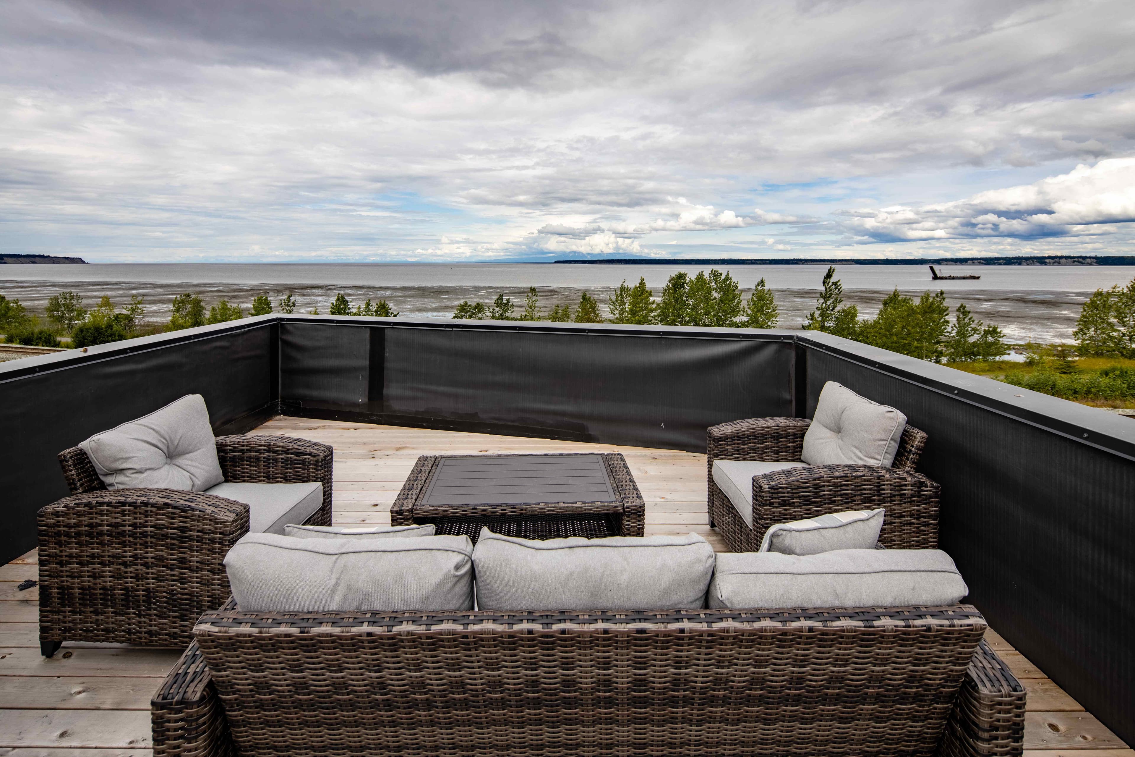 Rooftop deck seating with panoramic Cook Inlet and mountain views, Villa at Bootleggers Landing Anchorage Alaska