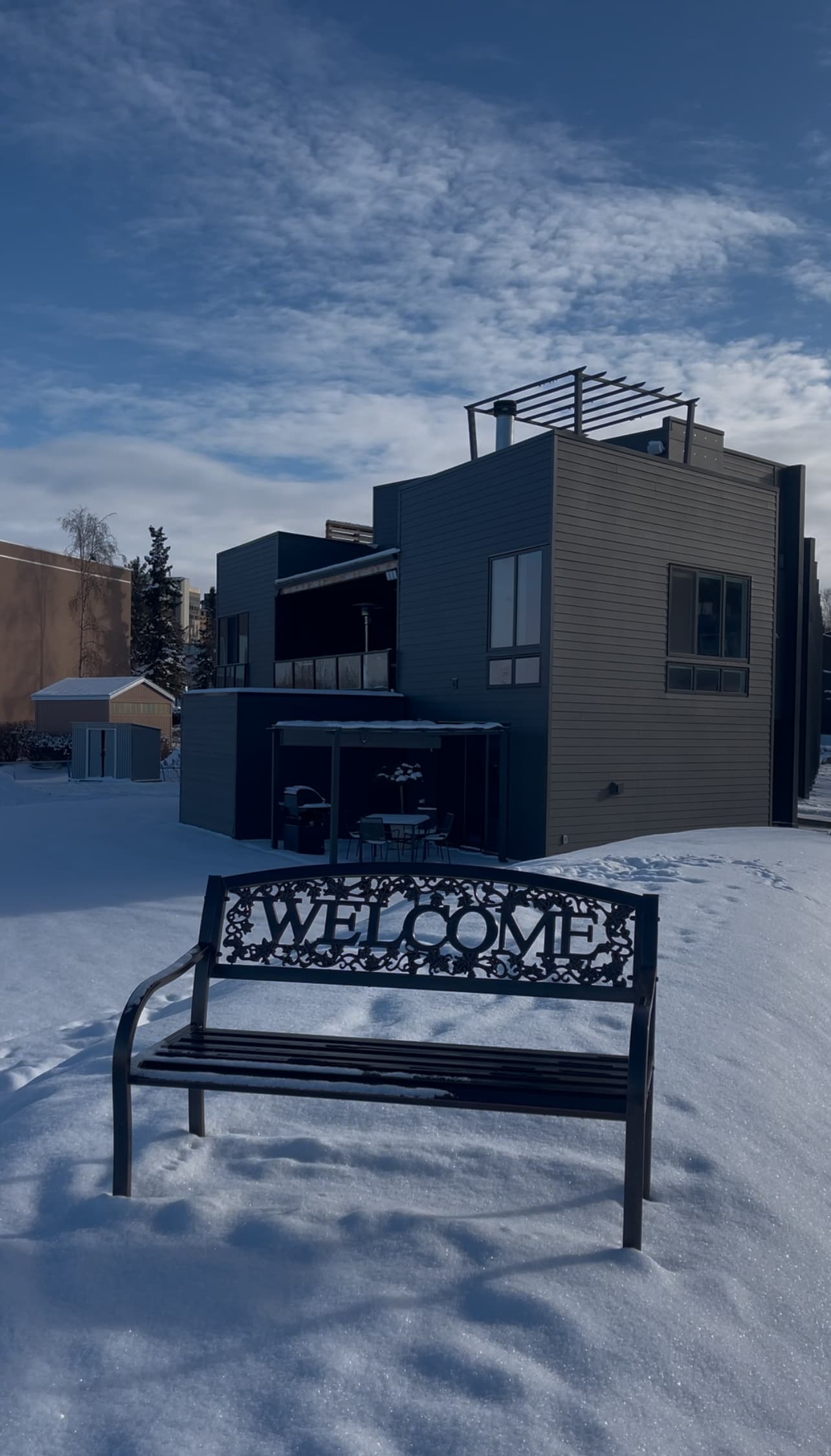 Winter exterior Villa at Bootleggers Landing with snow and Cook Inlet, Anchorage Alaska