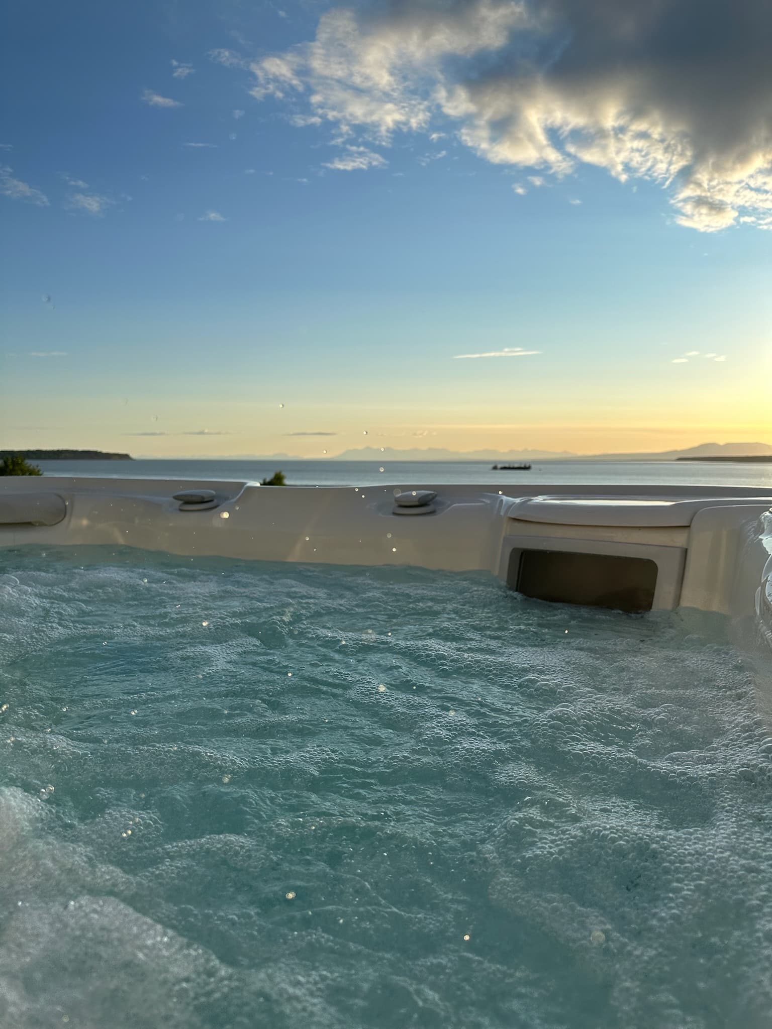 Year-round rooftop hot tub with panoramic Cook Inlet and mountain views at Villa at Bootleggers Landing, Anchorage Alaska luxury rental