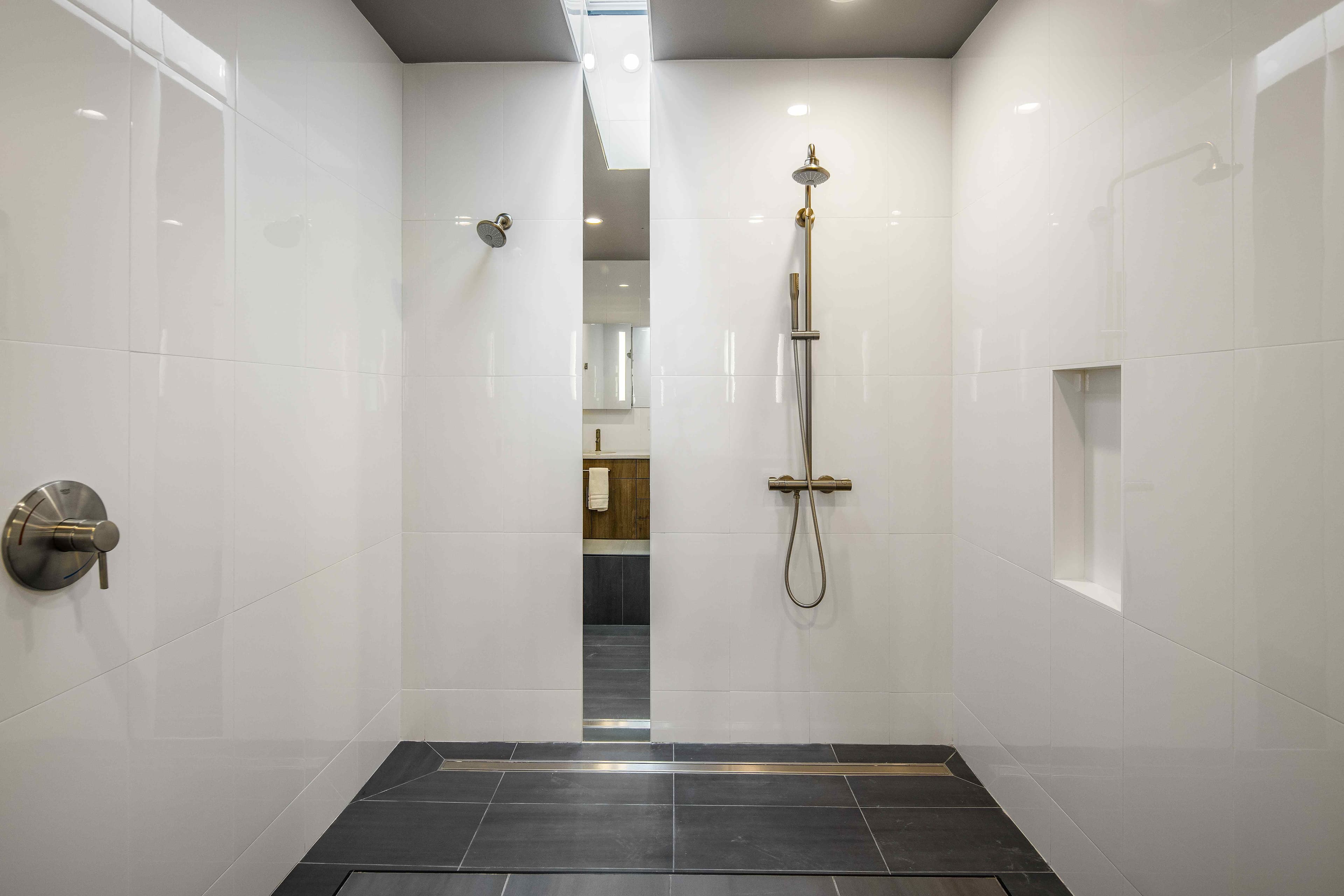 Spa-worthy master bathroom with dual rainfall shower, Villa at Bootleggers Landing luxury bath