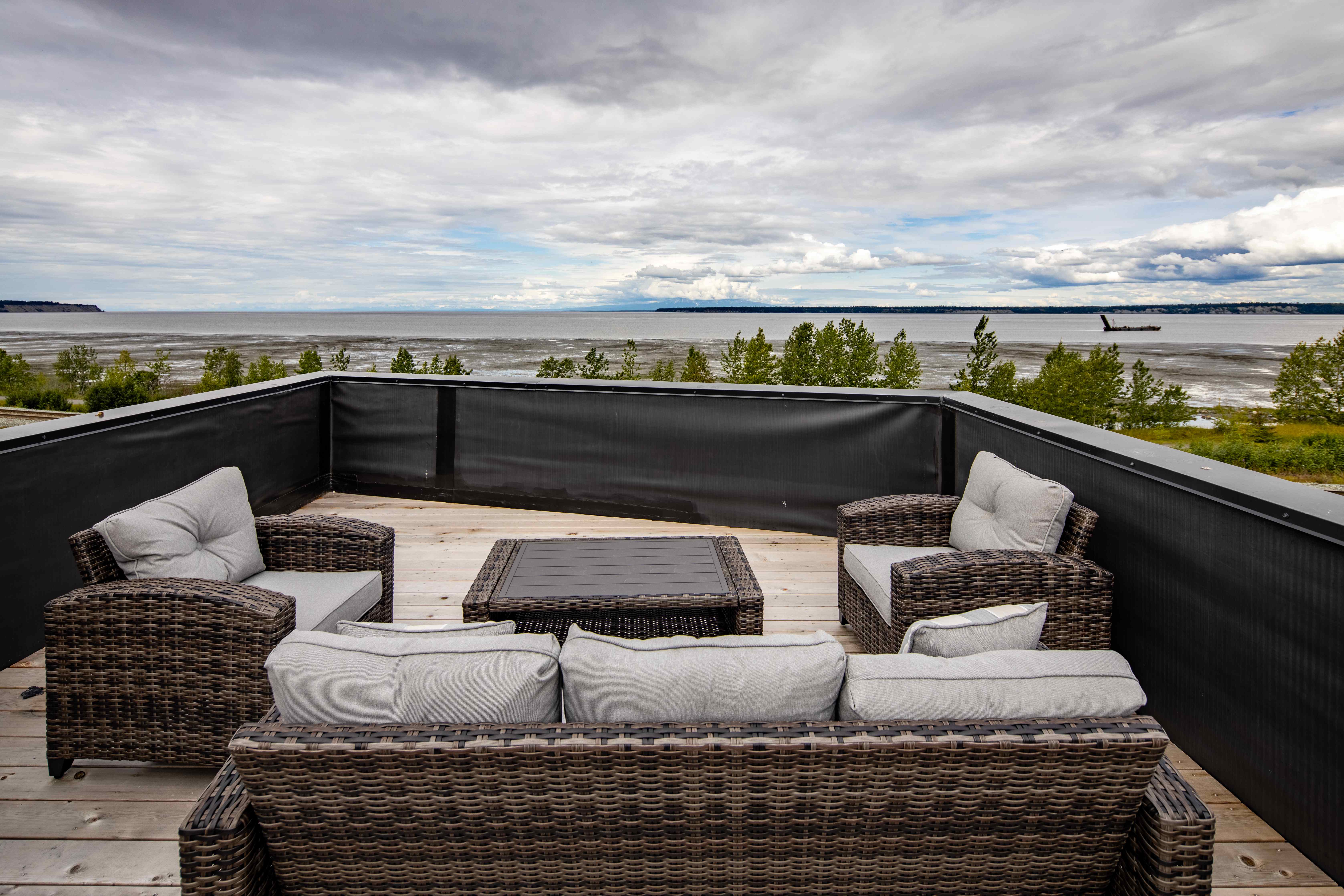 Rooftop deck seating with panoramic Cook Inlet and mountain views, Villa at Bootleggers Landing Anchorage Alaska