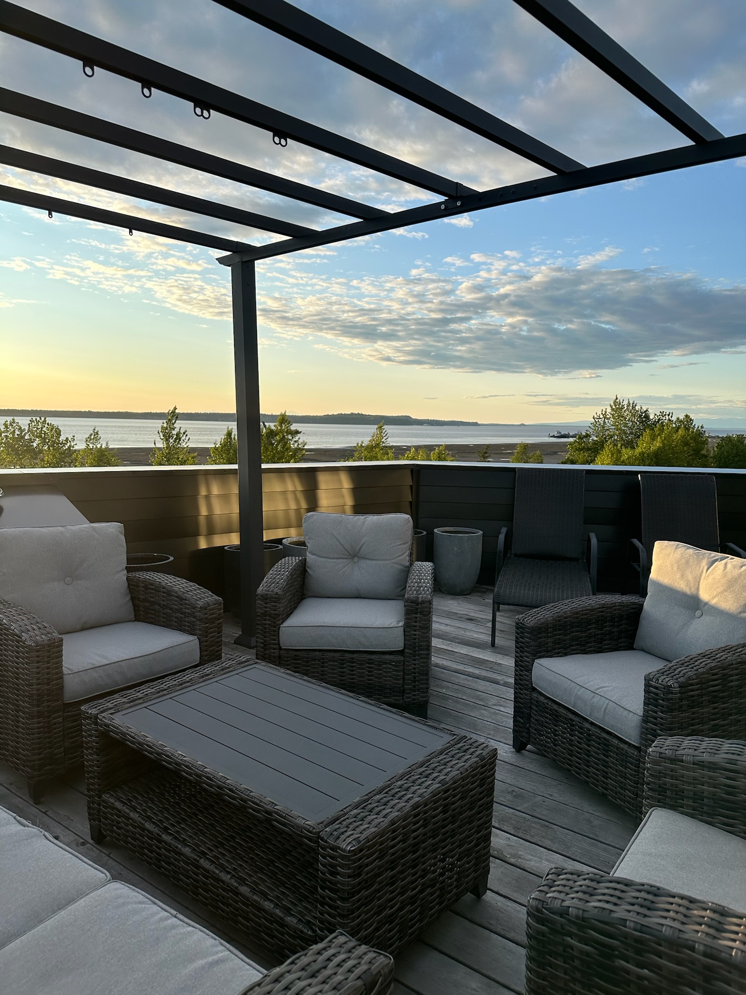 Outdoor deck furniture with Cook Inlet waterfront views, luxury Alaska vacation rental