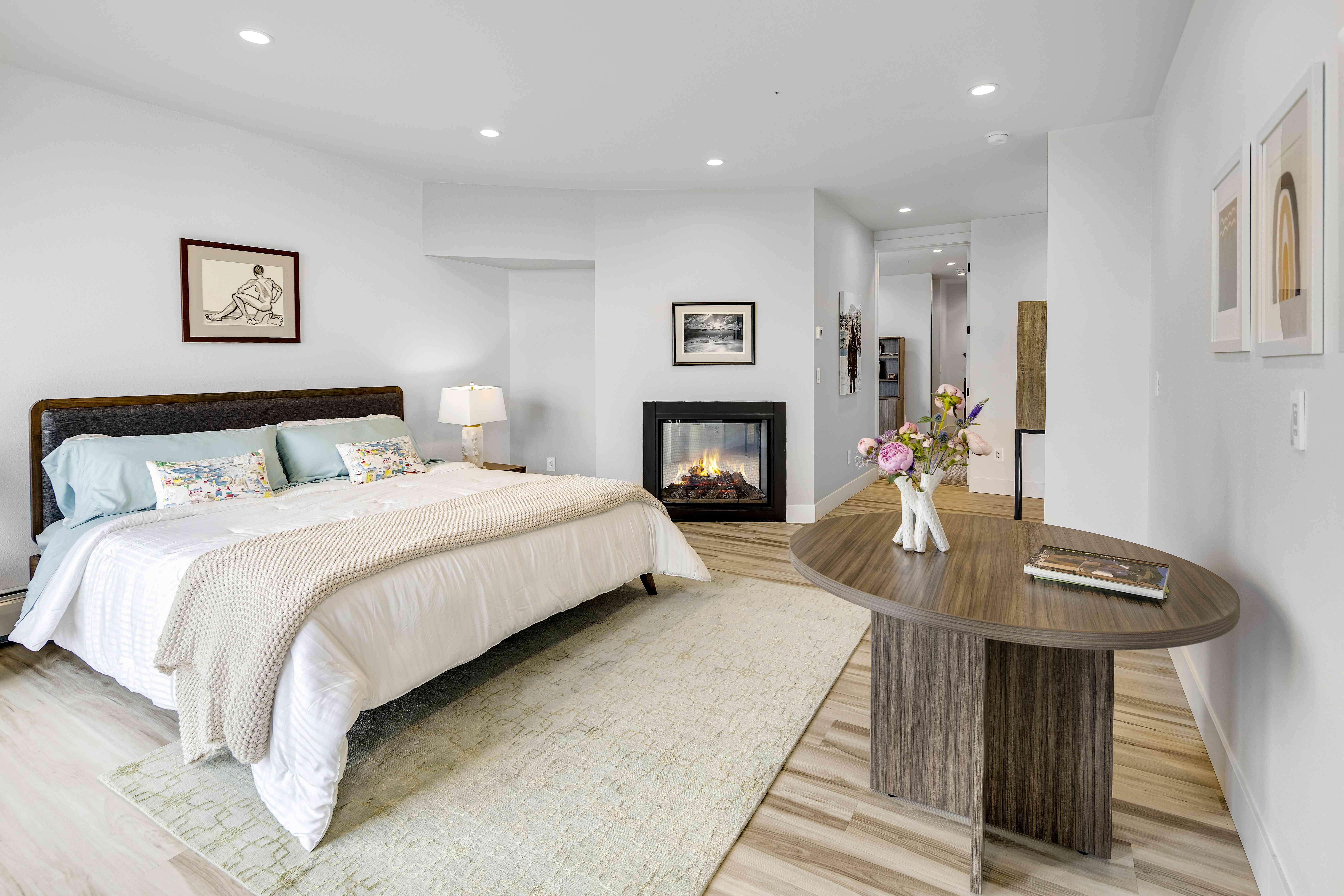 Master bedroom gas fireplace with Cook Inlet views, Villa at Bootleggers Landing