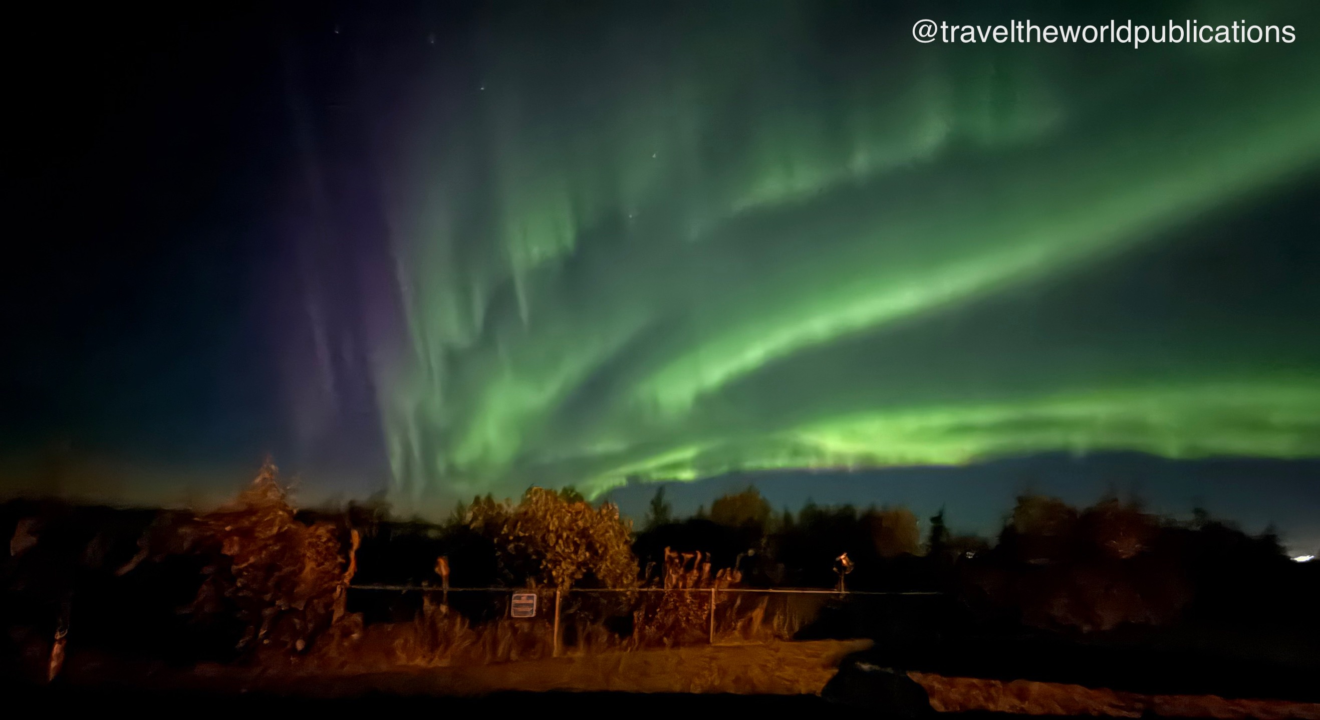 Northern Lights aurora over Cook Inlet viewed from luxury vacation rental deck, Alaska